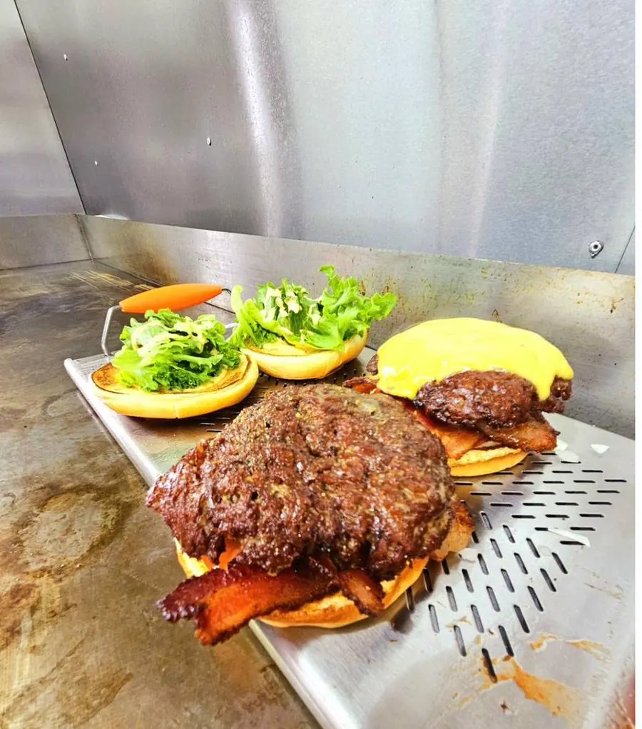 Burgers cooking on the flat-top grill Okie Burger Oklahoma